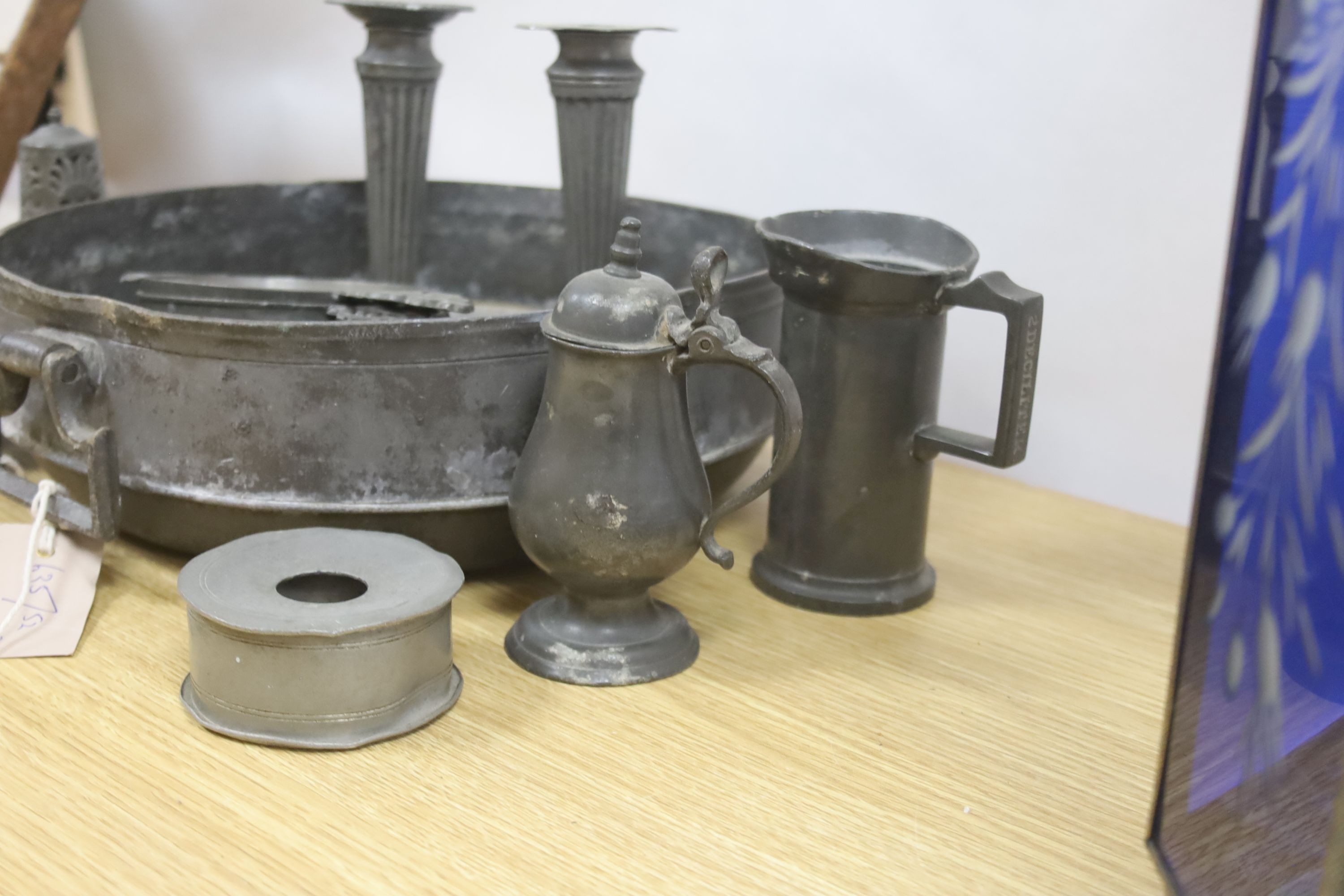 A collection of Dutch antique pewter, including two-handled bowl, wine taster, measures, etc.
